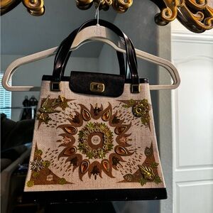 Elegant Black and Tan Handbag with Floral Design